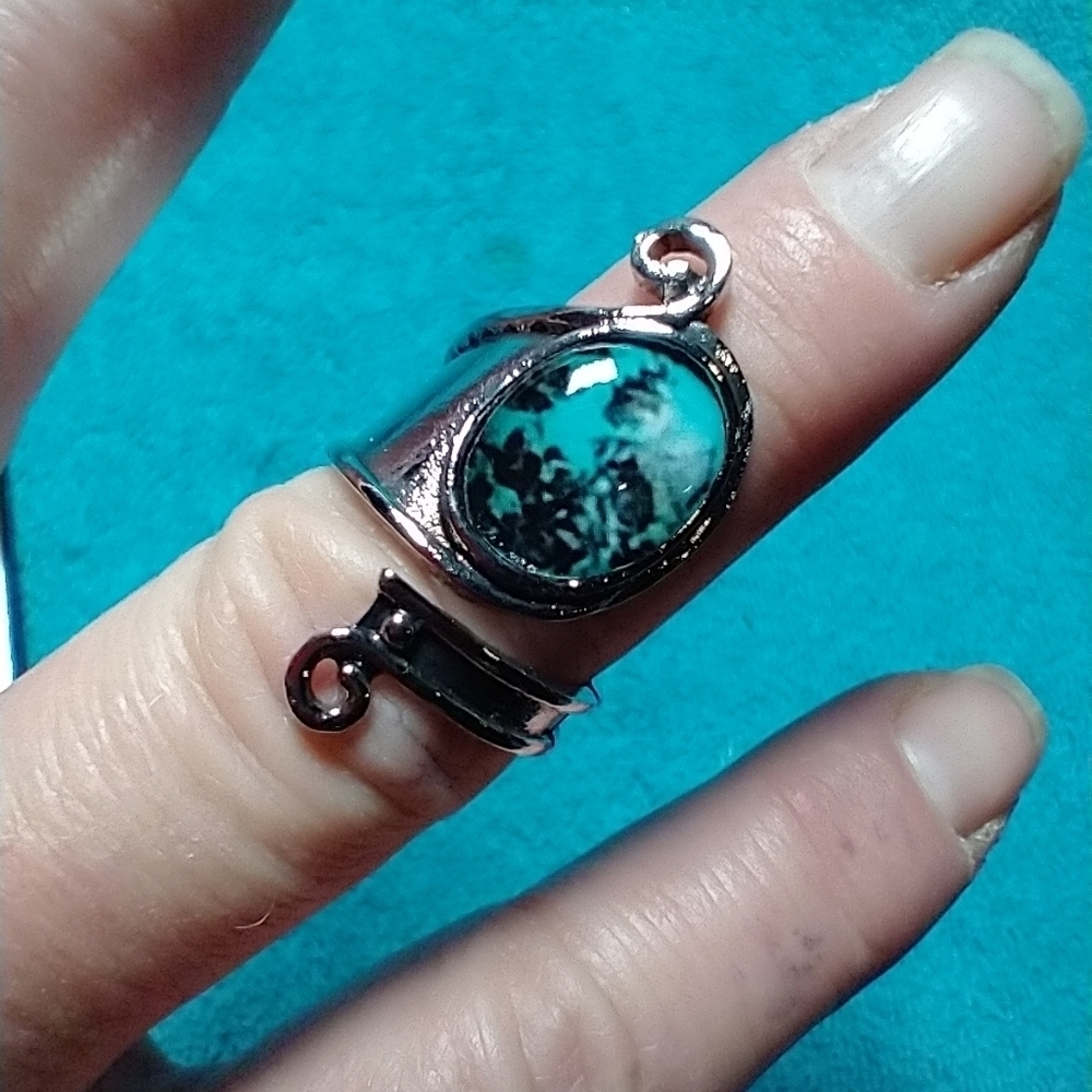 Silvertone blue black stone adjustable ring spoon design